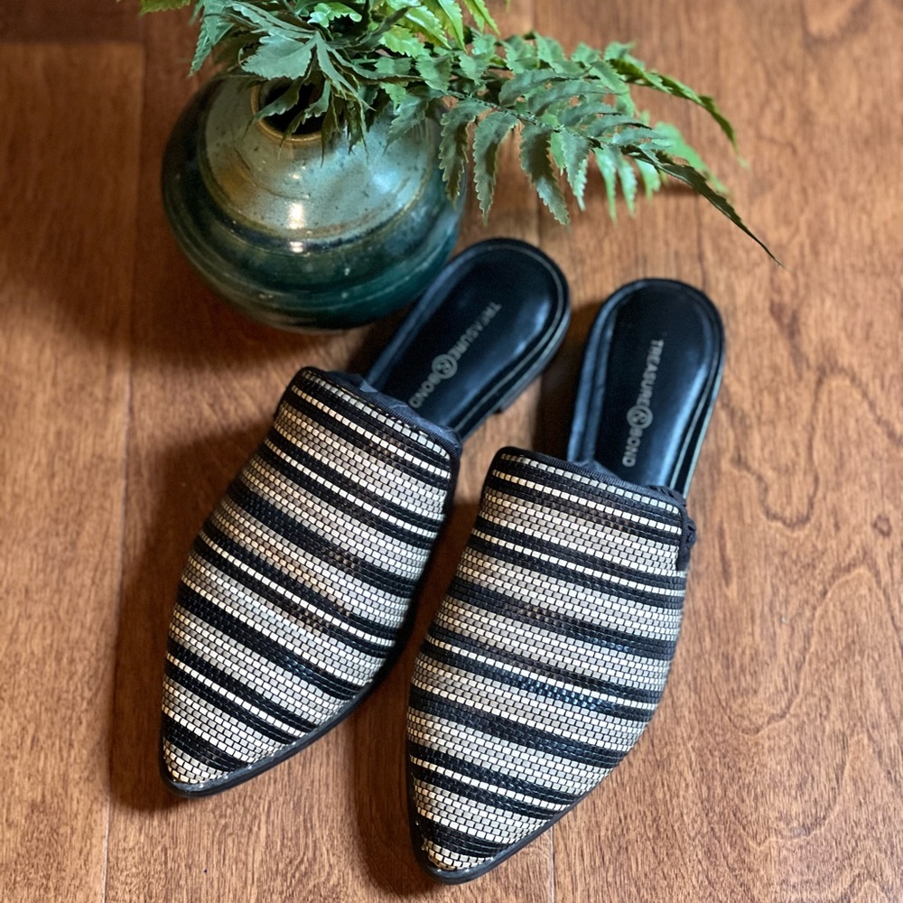 Woman’s Black and Tan and white slip on mules.